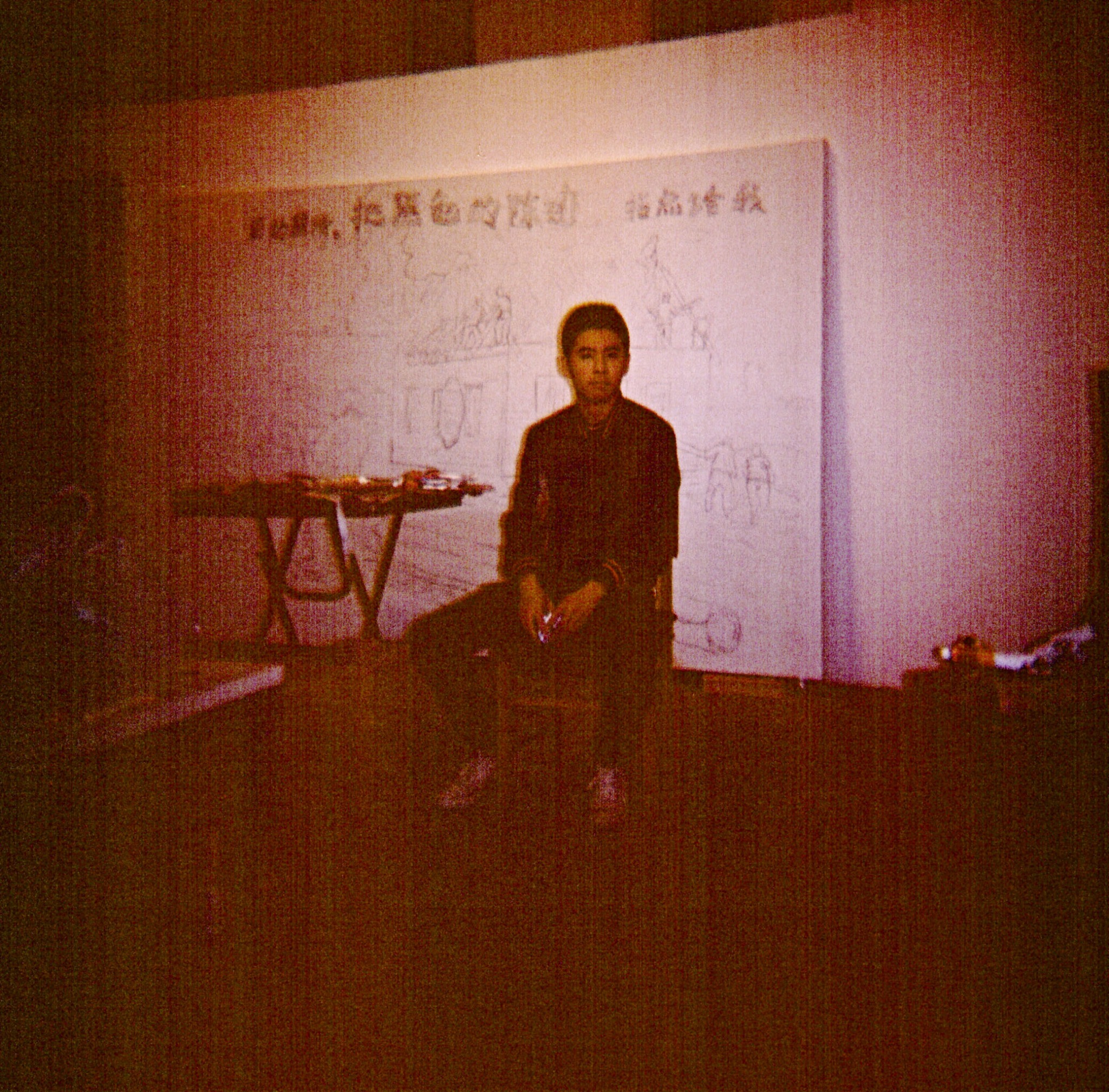 Portrait in a studio with a drawing